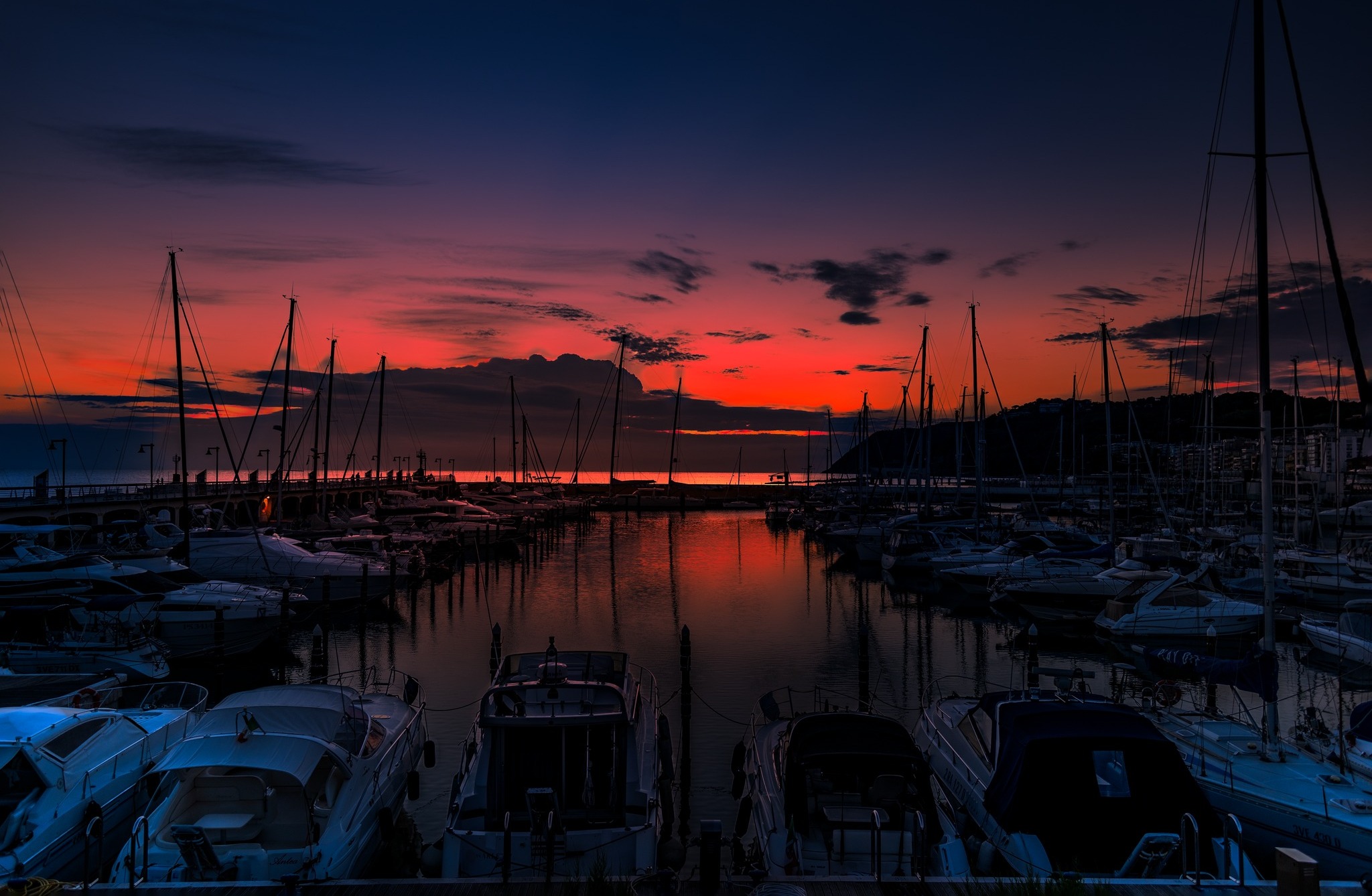 Yacht marina in the sea at sunset